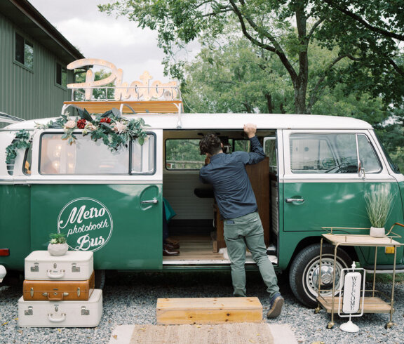 Green bus at a wedding with rental decor
